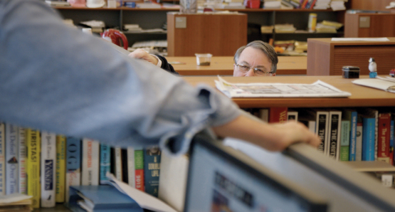 The obituaries desk in <i>The New York Times</i> newsroom.